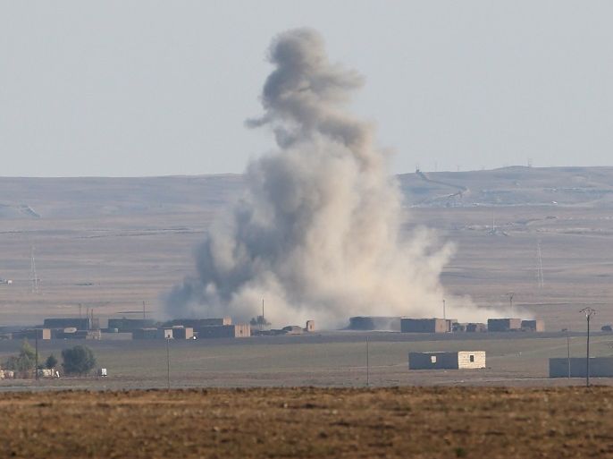 HOLE, SYRIA - NOVEMBER 10: An airstrike by a U.S. led coaltion warplane explodes on an ISIL position on November 10, 2015 near the town of Hole, Rojava, Syria. Troops from the Syrian Democratic Forces, a coalition of Kurdish and Arab units, are attacking ISIL extremists in the area near the Iraqi border. The predominantly Kurdish region of Rojava in northern Syria has become a bulwark against the Islamic State. Their armed forces, with the aid of U.S. airstrikes and we