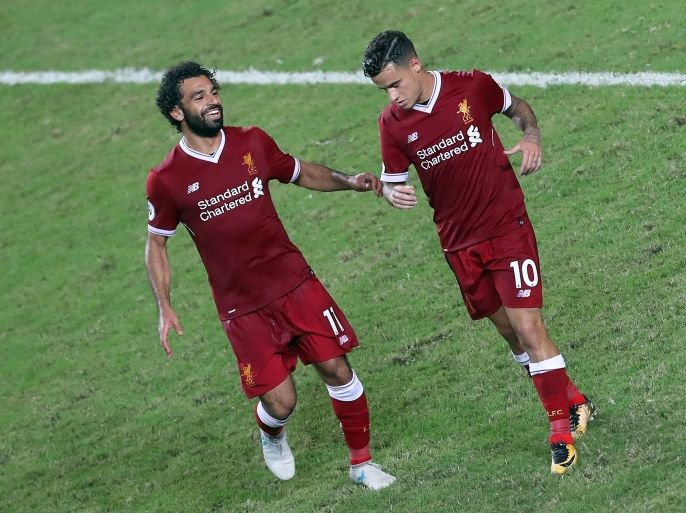 HONG KONG - JULY 22: Philippe Coutinho of Liverpool reels away after scoring while Mohamed Salah runs to embrace him during the Premier League Asia Trophy match between Liverpool FC and Leicester City FC at Hong Kong Stadium on July 22, 2017 in Hong Kong, Hong Kong. (Photo by Stanley Chou/Getty Images )
