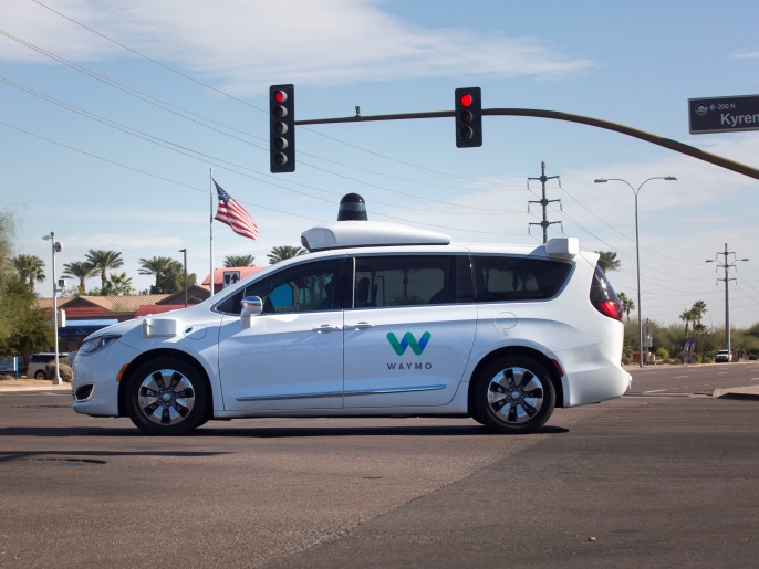 A Waymo self-driving vehicle moves through an intersection in Chandler Arizona, U.S., December 2, 2017. Photo taken on December 2, 2017. REUTERS/Natalie Behring