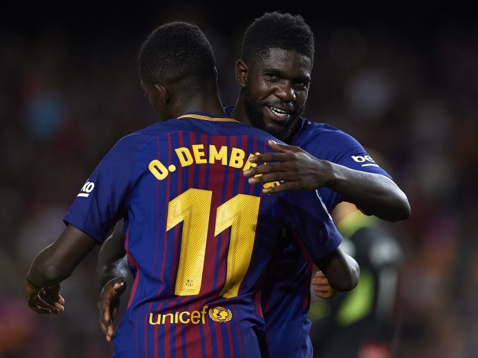 BARCELONA, SPAIN - SEPTEMBER 09: Ousmane Dembele and Samuel Umtiti of Barcelona celebrate during the La Liga match between Barcelona and Espanyol at Camp Nou on September 9, 2017 in Barcelona, Spain. (Photo by Manuel Queimadelos Alonso/Getty Images)