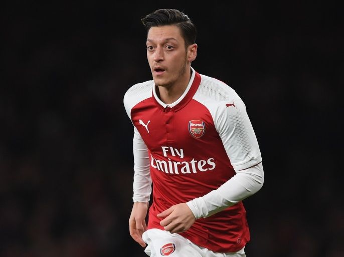 LONDON, ENGLAND - JANUARY 24: Mesut Ozil of Arsenal runs with the ball during Carabao Cup Semi-Final Second Leg match between Arsenal and Chelsea the at Emirates Stadium on January 24, 2018 in London, England. (Photo by Shaun Botterill/Getty Images)