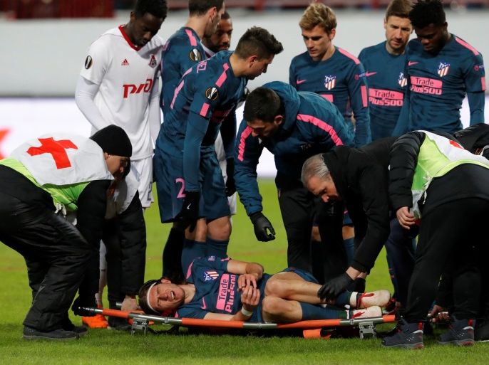 Soccer Football - Europa League Round of 16 Second Leg - Lokomotiv Moscow vs Atletico Madrid - RZD Arena, Moscow, Russia - March 15, 2018 Atletico Madrid's Filipe Luis is stretchered off after sustaining an injury REUTERS/Sergei Karpukhin
