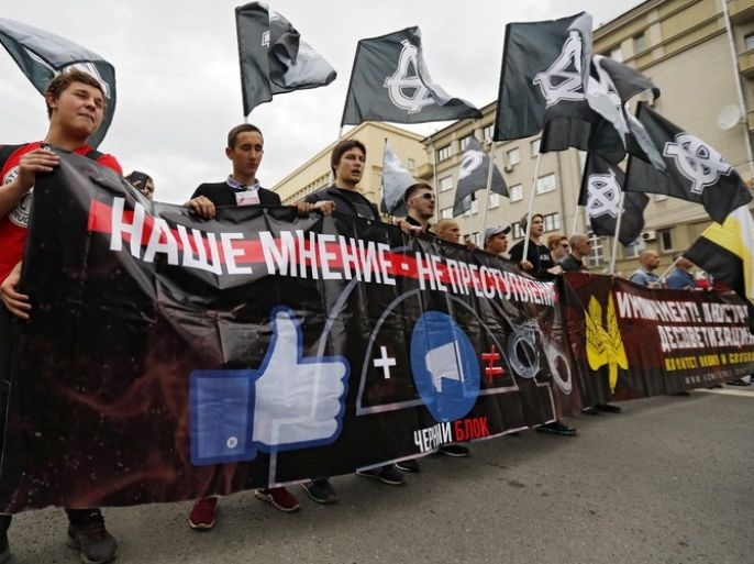 epa06164594 Russian activists carry a banner reading 'The censorship' during a rally for free internet in Moscow, Russia, 26 August 2017. In 2016, Russia passed the Yarovaya law, a package of legal amendments intended to combat terrorism that limited internet privacy and tightened government control over the internet. EPA-EFE/SERGEI ILNITSKY