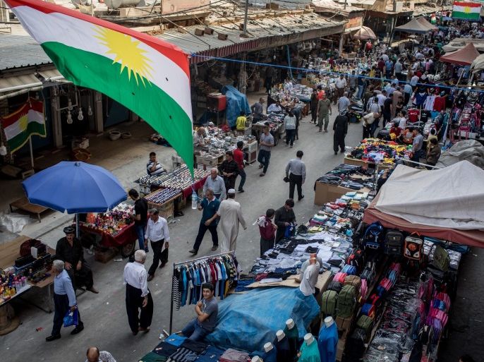 ERBIL, IRAQ - SEPTEMBER 22: People are seen shopping under the Kurdish flag at a market in the old city on September 22, 2017 in Erbil, Iraq. The Kurdish Regional government is preparing to hold the September 25, independence referendum despite strong objection from neighboring countries and the Iraqi government, which voted Tuesday to reject Kurdistan's referendum and authorized the Prime Minister Haider al-Abadi to take measures against the vote. Despite the mounting pressures Kurdistan President Masoud Barzani continues to campaign and state his determination to go ahead with the vote. (Photo by Chris McGrath/Getty Images)