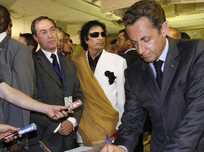 Libya's President Muammar Gaddafi (2ndR), French President Nicolas Sarkozy (R) and Claude Gueant (2ndL), General Secretary of the Elysee Palace, visit Bab Azizia Palace in Tripoli July 25, 2007 the day after the release of six foreign medics from Libyan jails. France has opened a judicial investigation into allegations that former President Nicolas Sarkozy's 2007 election bid won illicit funds from late Libyan leader Muammar Gaddafi, the public prosecutor's office s