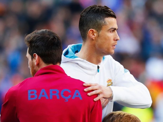 MADRID, SPAIN - DECEMBER 23: Cristiano Ronaldo of Real Madrid greets Lionel Messi of Barcelona prior to the La Liga match between Real Madrid and Barcelona at Estadio Santiago Bernabeu on December 23, 2017 in Madrid, Spain. (Photo by Gonzalo Arroyo Moreno/Getty Images)
