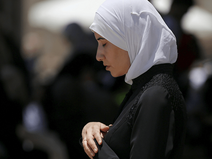 A Palestinian woman prays on the fourth Friday of the holy month of Ramadan at the compound known to Muslims as the Noble Sanctuary and to Jews as Temple Mount, in Jerusalem's Old City July 10, 2015. An Israeli police spokesperson said on Friday that some 140,000 people attended the prayers on the compound and some 56,000 Palestinians from the West Bank entered Jerusalem through Israeli checkpoints. REUTERS/Ammar Awad