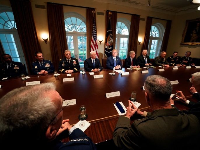 U.S. President Donald Trump receives a briefing from senior military leadership accompanied by Vice President Mike Pence and new National Security Adviser John Bolton at the Cabinet room of the White House in Washington, DC, U.S. April 9, 2018. REUTERS/Carlos Barria