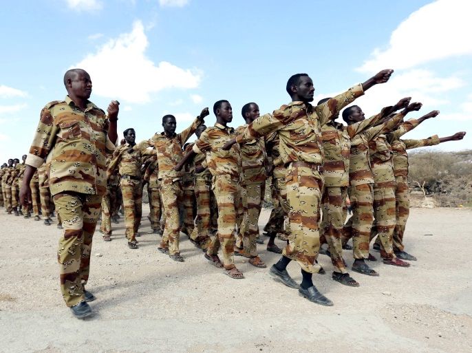 Somalia government soldiers from section 21 take part in a military exercise at their temporary camp in Dusamareeb, in this March 17, 2014 file photo, as they prepare an offensive advance against al Shabaab militants, who have retreated into the central areas of Somalia. Somalia's inability to pay and even feed its soldiers threatens to undermine years of hard-won military gains against Islamist al Shabaab rebels, with corruption sapping morale and weakening the army in the war against the militants. Picture taken March 17, 2014. To match Insight SOMALIA-SECURITY/REUTERS/Feisal Omar/Files