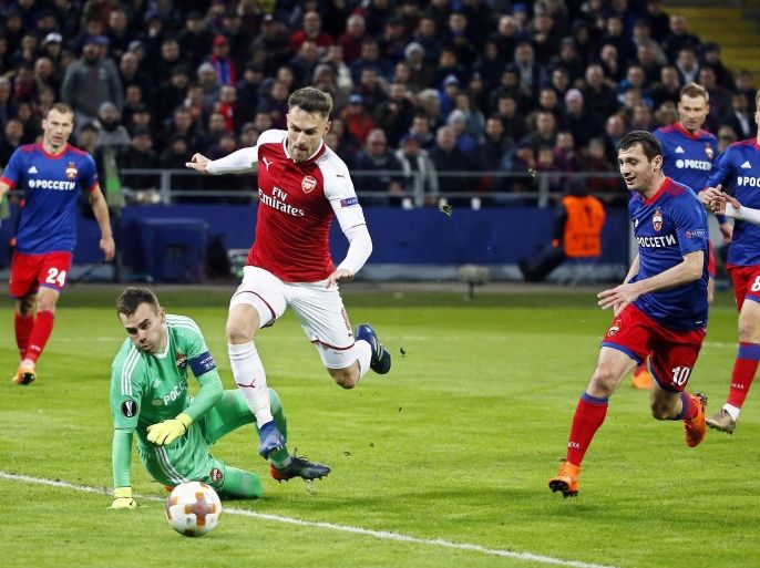 Description epa06665106 Aaron Ramsey (C) of Arsenal in action against CSKA Moscow's goalkeeper Igor Akinfeev (2-L) during the UEFA Europa League quarter final, second leg soccer match between CSKA Moscow and Arsenal FC in Moscow, Russia, 12 April 2018. EPA-EFE/MAXIM SHIPENKOV
