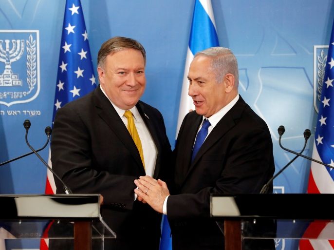 Israeli Prime Minister Benjamin Netanyahu shakes hands with U.S. Secretary of State Mike Pompeo during a meeting at the Ministry of Defence in Tel Aviv, Israel, April 29, 2018. Thomas Coex/Pool via Reuters