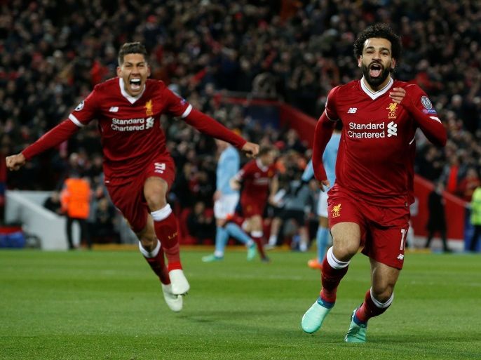 Soccer Football - Champions League Quarter Final First Leg - Liverpool vs Manchester City - Anfield, Liverpool, Britain - April 4, 2018 Liverpool's Mohamed Salah celebrates with Roberto Firmino after scoring their first goal REUTERS/Andrew Yates