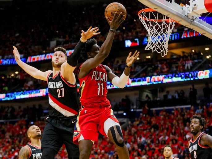 Apr 21, 2018; New Orleans, LA, USA; New Orleans Pelicans guard Jrue Holiday (11) shoots over Portland Trail Blazers center Jusuf Nurkic (27) during the second half in game four of the first round of the 2018 NBA Playoffs at the Smoothie King Center. Mandatory Credit: Derick E. Hingle-USA TODAY Sports