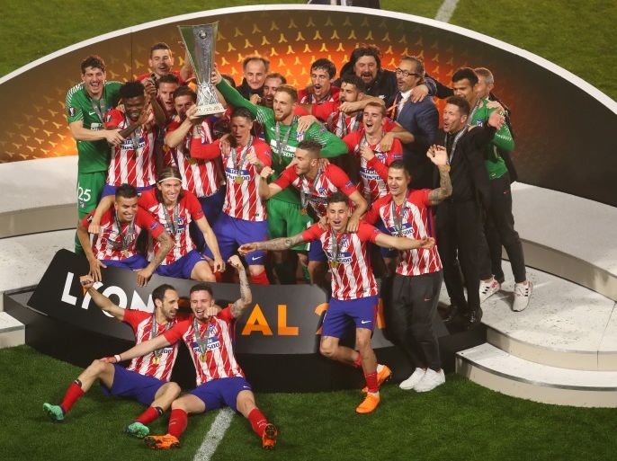 LYON, FRANCE - MAY 16: Atletico Madrid players lift The Europa League trophy after the UEFA Europa League Final between Olympique de Marseille and Club Atletico de Madrid at Stade de Lyon on May 16, 2018 in Lyon, France. (Photo by Catherine Ivill/Getty Images)