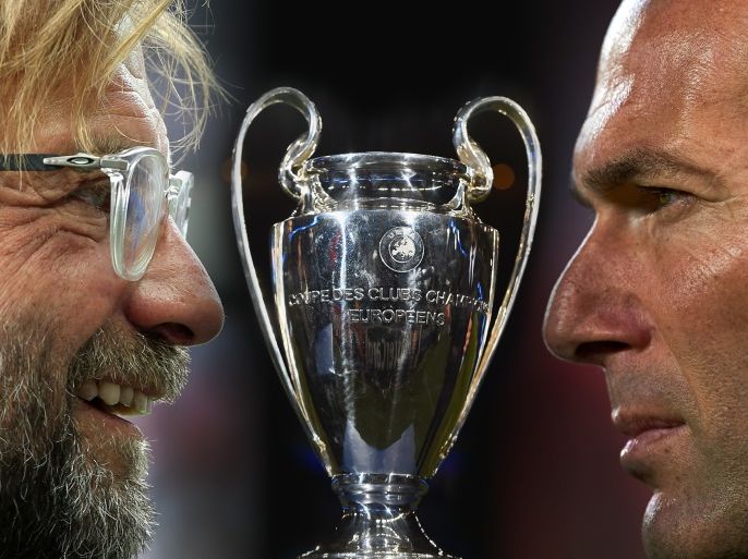 FILE PHOTO (EDITORS NOTE: COMPOSITE OF IMAGES - Image numbers L-R 824280260,464313758,956612460) In this composite image a comparision has been made between head coach Juergen Klopp of Liverpool (L) and head coach Zinedine Zidane of Real Madrid. Real Madrid and Liverpool meet in the UEFA Champions League Final on May 26, 2018 at the NSC Olimpiyskiy Stadium in Kiev, Ukraine. ***LEFT IMAGE*** BERLIN, GERMANY - JULY 29: Head coach Juergen Klopp of Liverpool looks on prior to the pre season friendly match between Hertha BSC and FC Liverpool at Olympiastadion on July 29, 2017 in Berlin, Germany. (Photo by Matthias Kern/Bongarts/Getty Images) ***RIGHT IMAGE*** SEVILLE, SPAIN - MAY 09: Head coach Zinedine Zidane of Real Madrid looks on prior to the start the La Liga match between Sevilla FC and Real Madrid at Ramon Sanchez Pizjuan stadium on May 9, 2018 in Seville, Spain. (Photo by Aitor Alcalde/Getty Images)