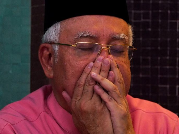 Malaysia’s former Prime Minister Najib Razak prays before he attends the United Malays National Organisation (UMNO) 72th anniversary celebrations in Kuala Lumpur, Malaysia May 11, 2018. REUTERS/Athit Perawongmetha/