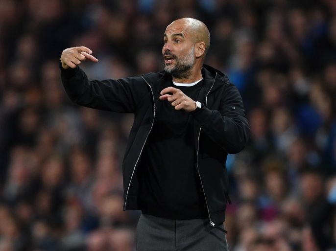 MANCHESTER, ENGLAND - MAY 09: Josep Guardiola, Manager of Manchester City gives instruction to his team during the Premier League match between Manchester City and Brighton and Hove Albion at Etihad Stadium on May 9, 2018 in Manchester, England. (Photo by Gareth Copley/Getty Images)