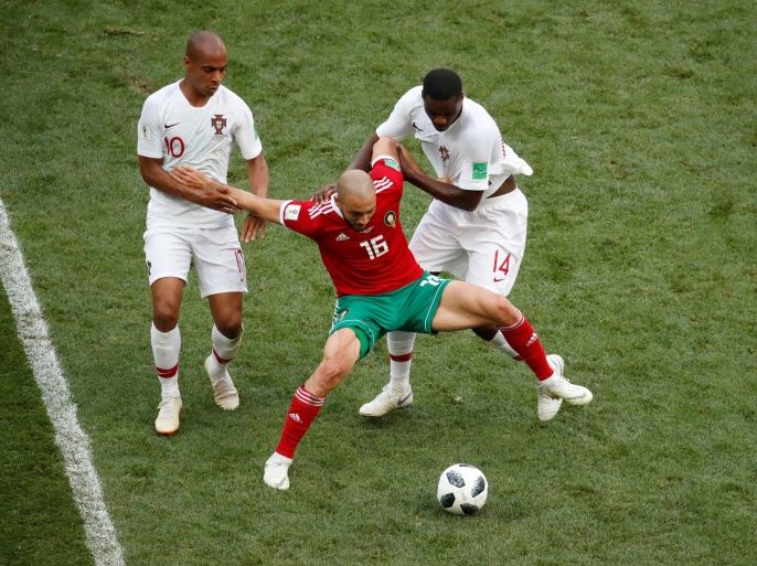 Soccer Football - World Cup - Group B - Portugal vs Morocco - Luzhniki Stadium, Moscow, Russia - June 20, 2018 Morocco's Nordin Amrabat in action with Portugal's Joao Mario and William Carvalho REUTERS/Christian Hartmann
