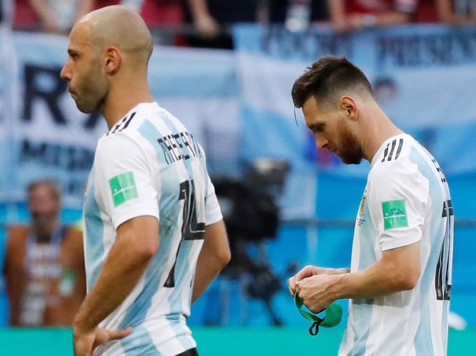 Soccer Football - World Cup - Round of 16 - France vs Argentina - Kazan Arena, Kazan, Russia - June 30, 2018 Argentina's Lionel Messi and Javier Mascherano look dejected after the match REUTERS/Carlos Garcia Rawlins