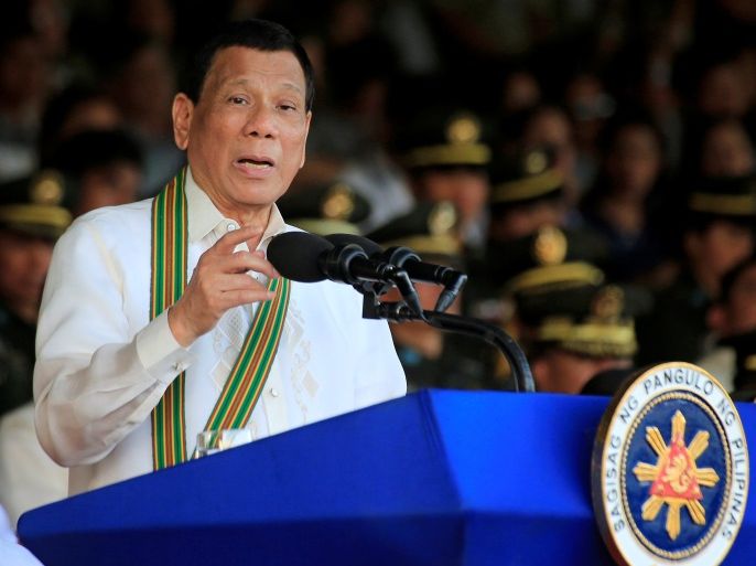 Philippine President Rodrigo Duterte gestures as he delivers a speech during the 121st founding anniversary of the Philippine Army (PA) at Taguig city, Metro Manila, Philippines March 20, 2018. REUTERS/Romeo Ranoco