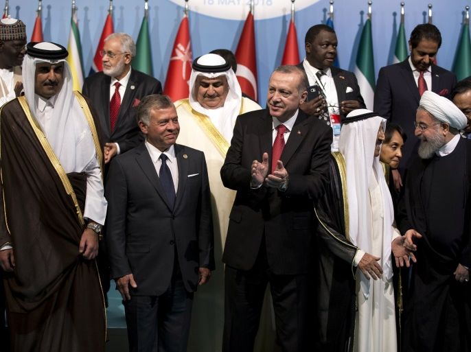 Turkish President Tayyip Erdogan poses with leaders and representatives of the Organisation of Islamic Cooperation (OIC) member states for a group photo during an extraordinary meeting in Istanbul, Turkey May 18, 2018. Arif Hudaverdi Yaman/Pool via Reuters