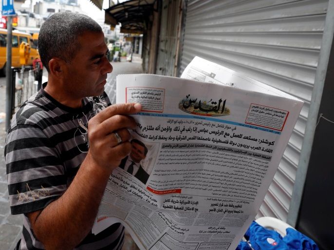 A man reads the Palestinian newspaper Al Quds that published an interview with Jared Kushner, U.S. President Donald Trump's senior adviser, in Ramallah in the occupied West Bank, June 24, 2018. REUTERS/Mohamad Torokman