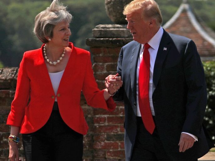 Britain's Prime Minister Theresa May and U.S. President Donald Trump walk to a joint news conference at Chequers, the official country residence of the Prime Minister, near Aylesbury, Britain, July 13, 2018. REUTERS/Hannah McKay TPX IMAGES OF THE DAY