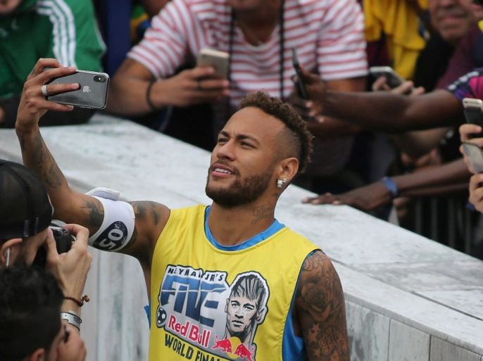 Soccer player Neymar takes a selfie with his fans in the Neymar Jr's Five soccer tournament in Santos, state of Sao Paulo, Brazil July 21, 2018. REUTERS/Amanda Perobelli