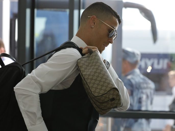 Soccer Football - World Cup - Portugal Departure - Zhukovsky International Airport, Moscow Region, Russia - July 1, 2018. Cristiano Ronaldo walks at the airport before the departure. REUTERS/Tatyana Makeyeva
