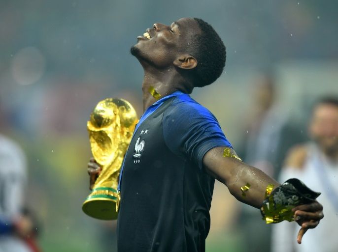 Soccer Football - World Cup - Final - France v Croatia - Luzhniki Stadium, Moscow, Russia - July 15, 2018 France's Paul Pogba holds the trophy as he celebrates winning the World Cup REUTERS/Dylan Martinez TPX IMAGES OF THE DAY SEARCH