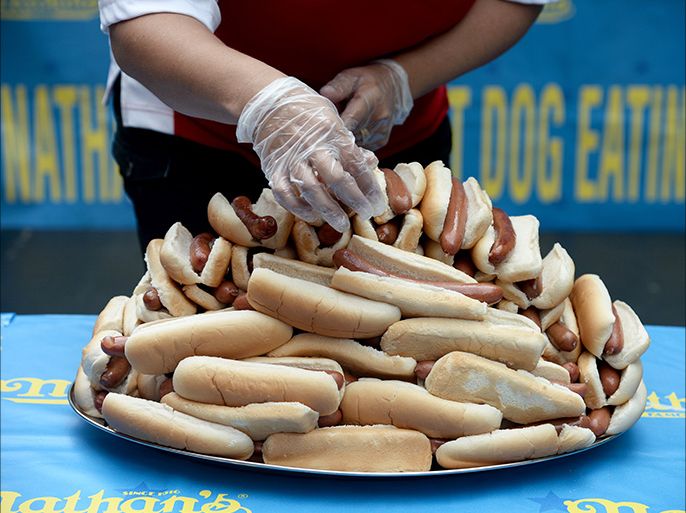 epa03773418 Hot dogs are set up for display prior to the weigh in for the Nathan's Famous Fourth of July International Hot Dog Eating Contest at City Hall Park in New York, New York, USA, 03 July 2013. Contestants will try to eat as many hot dogs as they can in 10 min on 04 July 2013. EPA/ANDREW GOMBERT