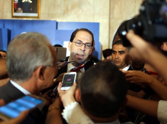 epa05453080 Tunisia's newly appointed prime minister Youssef Chahed speaks to media after being appointed by the Tunisian president at Carthage Palace in Carthage, Tunis,Tunisia, 03 August 2016. EPA/MOHAMED MESSARA