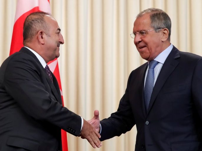 Russia's Foreign Minister Sergei Lavrov shakes hands with his Turkish counterpart Mevlut Cavusoglu after a news conference in Moscow, Russia August 24, 2018. REUTERS/Maxim Shemetov