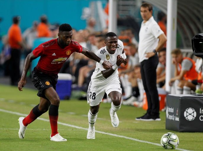 Soccer Football - International Champions Cup - Manchester United v Real Madrid - Hard Rock Stadium, Miami, USA - July 31, 2018 Manchester United's Timothy Fosu-Mensah in action with Real Madrid's Vinicius Junior REUTERS/Andrew Innerarity