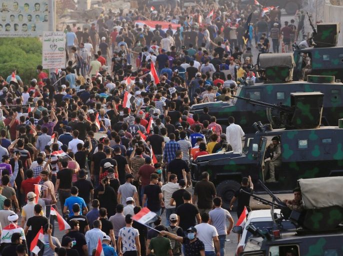 Iraqi protesters gather during a protest near the building of the government office in Basra, Iraq September 5, 2018. REUTERS/Alaa al-Marjani