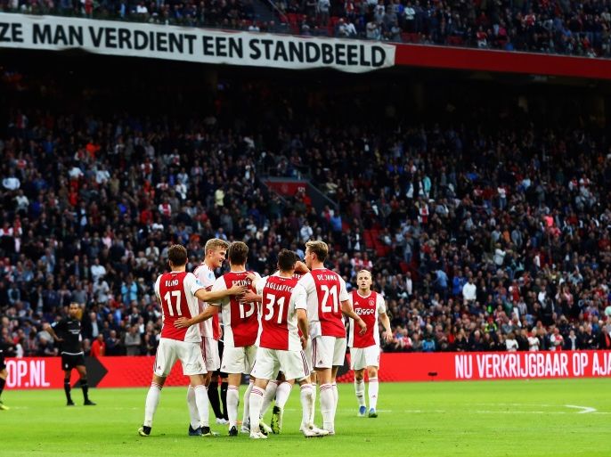 AMSTERDAM, NETHERLANDS - AUGUST 25: Klaas-Jan Huntelaar of Ajax celebrates scoring his teams third goal of the game with team mates during the Eredivisie match between Ajax and Emmen at Johan Cruyff Arena on August 25, 2018 in Amsterdam, Netherlands. (Photo by Dean Mouhtaropoulos/Getty Images)