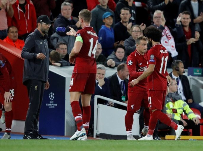 Soccer Football - Champions League - Group Stage - Group C - Liverpool v Paris St Germain - Anfield, Liverpool, Britain - September 18, 2018 Liverpool's Xherdan Shaqiri comes on as a substitute to replace Liverpool's Mohamed Salah as Jordan Henderson speaks with manager Juergen Klopp REUTERS/Phil Noble
