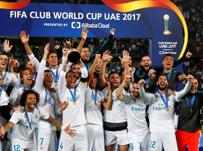 Soccer Football - FIFA Club World Cup Final - Real Madrid vs Gremio FBPA - Zayed Sports City Stadium, Abu Dhabi, United Arab Emirates - December 16, 2017 Real Madrid’s Sergio Ramos and team mates celebrate with the trophy after winning the FIFA Club World Cup REUTERS/Amr Abdallah Dalsh