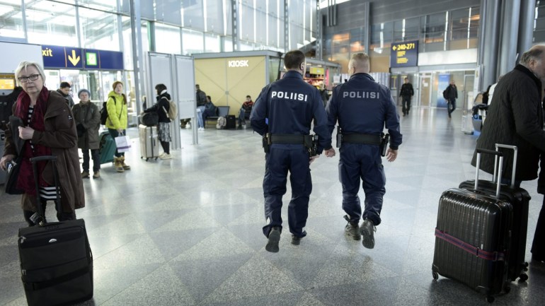 Police officers patrol the Helsinki-Vantaa airport in Vantaa, Finland March 22, 2016. Police in Denmark, Sweden and Finland have stepped up security at airports and public places following the explosions in Brussels on Tuesday. REUTERS/Heikki Saukkomaa/Lehtikuva ATTENTION EDITORS - THIS IMAGE WAS PROVIDED BY A THIRD PARTY. FOR EDITORIAL USE ONLY. NOT FOR SALE FOR MARKETING OR ADVERTISING CAMPAIGNS. THIS PICTURE IS DISTRIBUTED EXACTLY AS RECEIVED BY REUTERS, AS A SERVICE TO CLIENTS. NO THIRD PARTY SALES. NOT FOR USE BY REUTERS THIRD PARTY DISTRIBUTORS. FINLAND OUT. NO COMMERCIAL OR EDITORIAL SALES IN FINLAND.