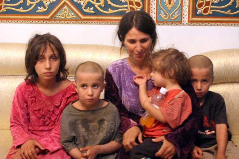 A woman and her children are seen after being freed from the Islamic State in Sweida, Syria October 20, 2018. Syrian Arab News Agency (SANA)/Handout via REUTERS ATTENTION EDITORS - THIS IMAGE HAS BEEN SUPPLIED BY A THIRD PARTY. REUTERS IS UNABLE TO INDEPENDENTLY VERIFY THIS IMAGE. IT IS DISTRIBUTED, EXACTLY AS RECEIVED BY REUTERS, AS A SERVICE TO CLIENTS.