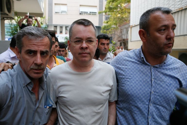 Turkey places jailed US cleric under house arrest- - IZMIR, TURKEY - JULY 25: American Pastor Andrew Craig Brunson (C), who was charged with committing crimes, including spying for the PKK terror group and the Fetullah Terrorist Organization, arrives at the address, which he was put under house arrest due to his health problems, in Izmir, Turkey on July 25, 2018.