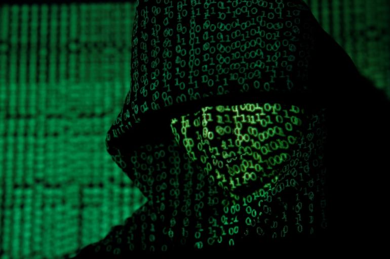 A projection of cyber code on a hooded man is pictured in this illustration picture taken on May 13, 2017. Capitalizing on spying tools believed to have been developed by the U.S. National Security Agency, hackers staged a cyber assault with a self-spreading malware that has infected tens of thousands of computers in nearly 100 countries. REUTERS/Kacper Pempel/Illustration TPX IMAGES OF THE DAY