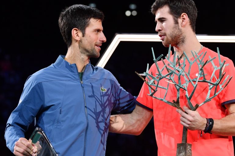 PARIS, FRANCE - NOVEMBER 04: Novak Djokovic of Serbia and Karen Khachanov of Russia pose with their trophys after Karen Khachanov wins the Men's Final during Day Seven of the Rolex Paris Masters on November 4, 2018 in Paris, France. (Photo by Justin Setterfield/Getty Images)