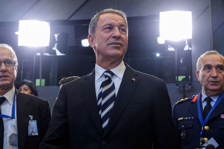 epa07066462 Turkey's Defense Minister Hulusi Akar (C) arrives for the start of Nato Defense Ministers meeting at the North Atlantic Treaty Organization (NATO) headquarters in Brussels, Belgium, 03 October 2018. Others are not identified. EPA-EFE/OLIVIER HOSLET