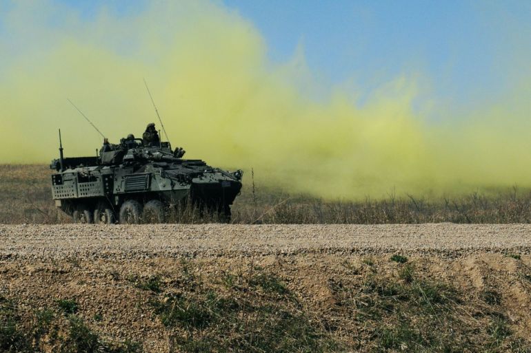 FILE PHOTO: A Canadian army Light Armoured Vehicle (LAV III) reacts to simulated chlorine gas as part of a training scenario during Operation Maple Resolve 2015 in Wainwright, Alberta, Canada May 10, 2015. REUTERS/US Army/Handout FOR EDITORIAL USE ONLY. NOT FOR SALE FOR MARKETING OR ADVERTISING CAMPAIGNSTHIS IMAGE HAS BEEN SUPPLIED BY A THIRD PARTY. IT IS DISTRIBUTED, EXACTLY AS RECEIVED BY REUTERS, AS A SERVICE TO CLIENTS.