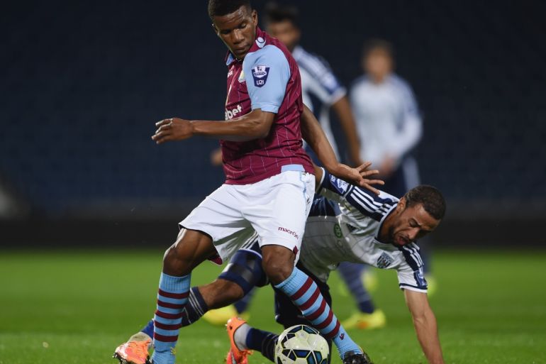 WEST BROMWICH, ENGLAND - OCTOBER 16: Riccardo Calder of Villa in action with Kemar Roofe of West Brom during the Barclays U21 Premier League match between West Bromwich Albion and Manchester United at The Hawthorns on October 16, 2014 in West Bromwich, England. (Photo by Michael Regan/Getty Images)