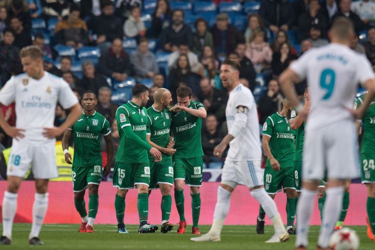 MADRID, SPAIN - JANUARY 24: Leganes players celebrate after scoring their opening goal during the Copa del Rey, Quarter Final, Second Leg match between Real Madrid and Leganes at the Santiago Bernabeu stadium on January 24, 2018 in Madrid, Spain. (Photo by Denis Doyle/Getty Images)