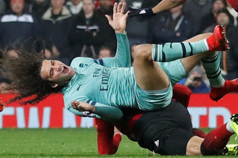 Soccer Football - Premier League - Manchester United v Arsenal - Old Trafford, Manchester, Britain - December 5, 2018 Arsenal's Matteo Guendouzi is fouled by Manchester United's Marcos Rojo Action Images via Reuters/Carl Recine EDITORIAL USE ONLY. No use with unauthorized audio, video, data, fixture lists, club/league logos or