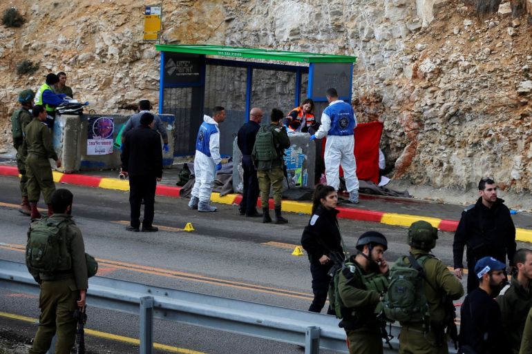 Israeli forces and medics are seen at the scene of a shooting attack near Ramallah in the Israeli-occupied West Bank December 13, 2018. REUTERS/Ammar Awad