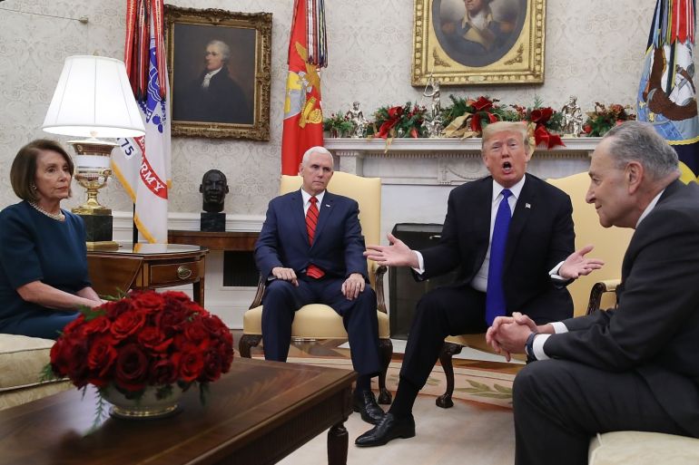 WASHINGTON, DC - DECEMBER 11: U.S. President Donald Trump (2R) argues about border security with Senate Minority Leader Chuck Schumer (D-NY) (R) and House Minority Leader Nancy Pelosi (D-CA) as Vice President Mike Pence sits nearby in the Oval Office on December 11, 2018 in Washington, DC. Mark Wilson/Getty Images/AFP== FOR NEWSPAPERS, INTERNET, TELCOS & TELEVISION USE ONLY ==